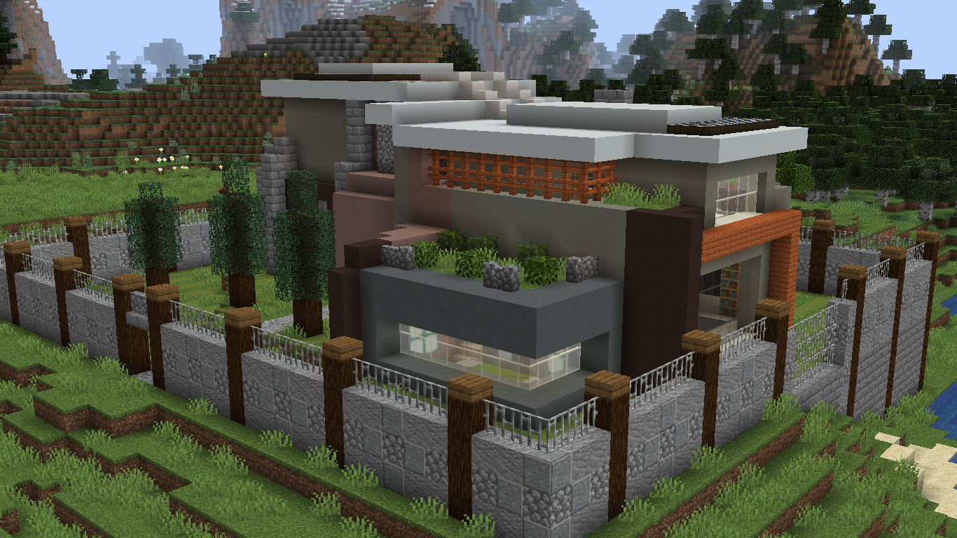 Maison moderne avec haute clôture en pierre dans minecraft